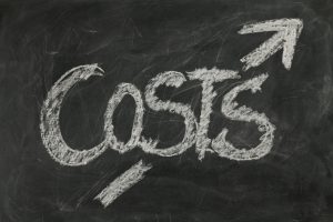 Chalk board with the word costs in chalk